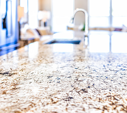 What gives granite its shine?